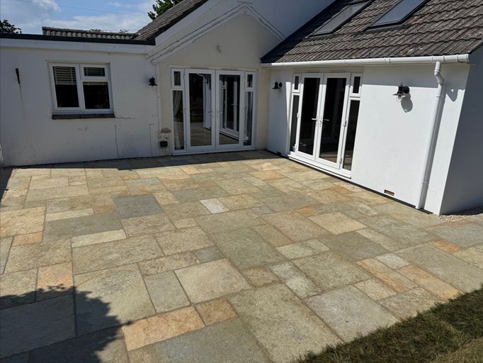 Natural stone patio installed outside residential property