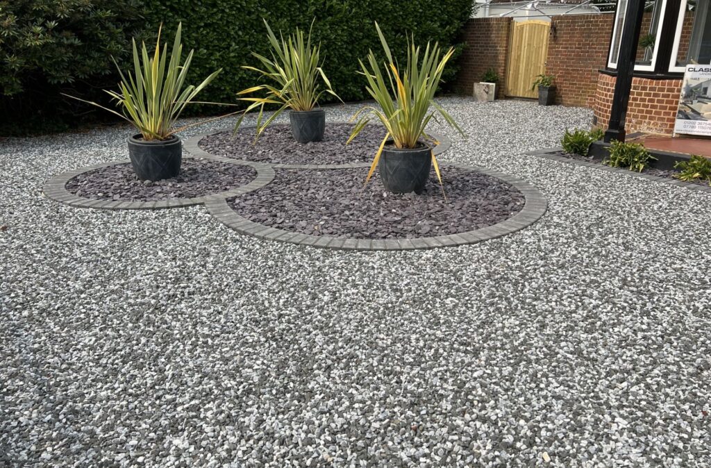 Decorative gravel garden with ornamental plants in Poole
